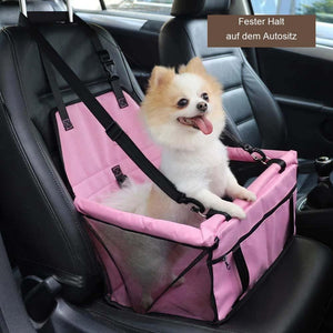 Rosa faltbarer Autositz für Hunde, Pomeranian sitzt darin im Auto | Fashion Peak